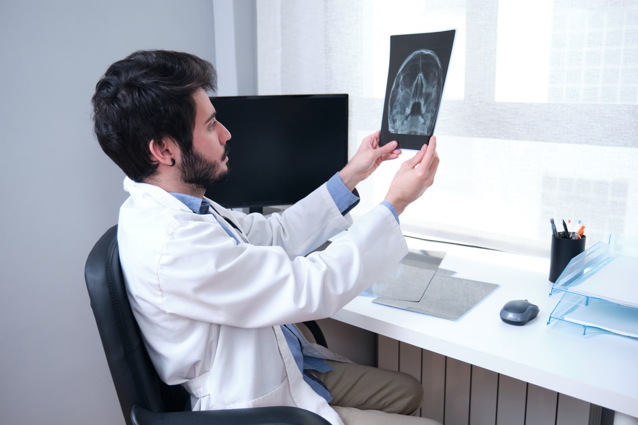 Man viewing a sinus x-ray.